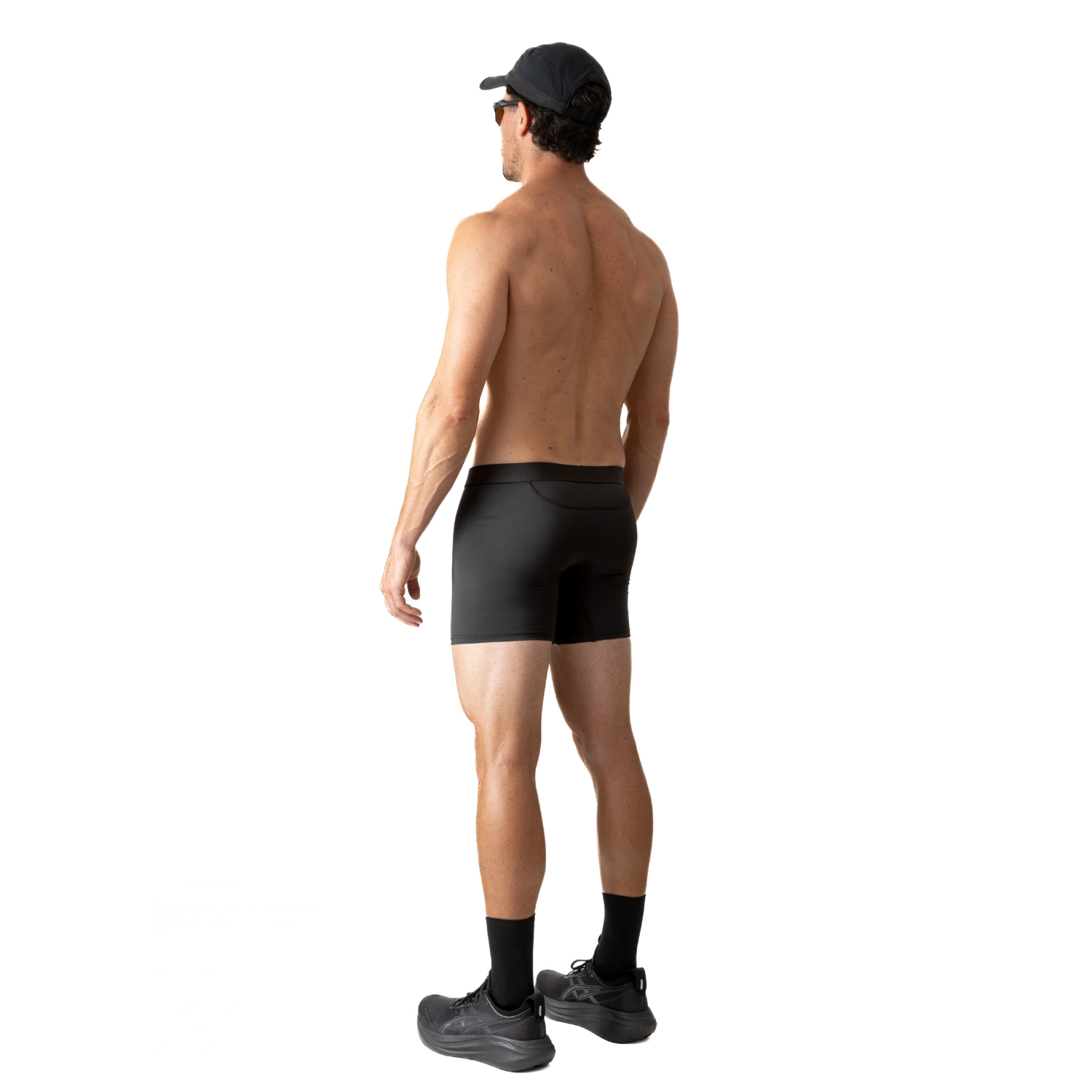 Back view of a person wearing ruhn performance underwear in Activated Black against a white background